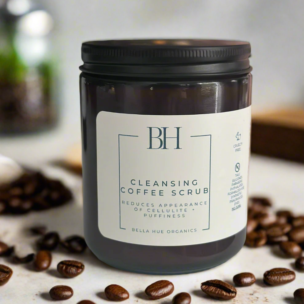 Jar of cleansing coffee scrub with 'BH' branding on a neutral background