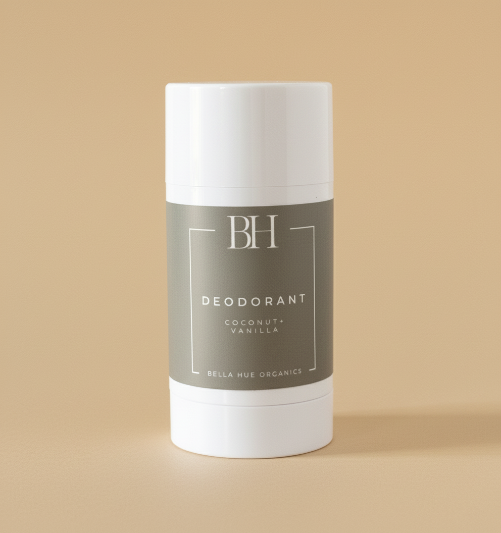 A stick deodorant with a white body and a label that reads 'BH DEODORANT COCONUT + VANILLA'. The packaging is minimalistic with a gray label and white background.