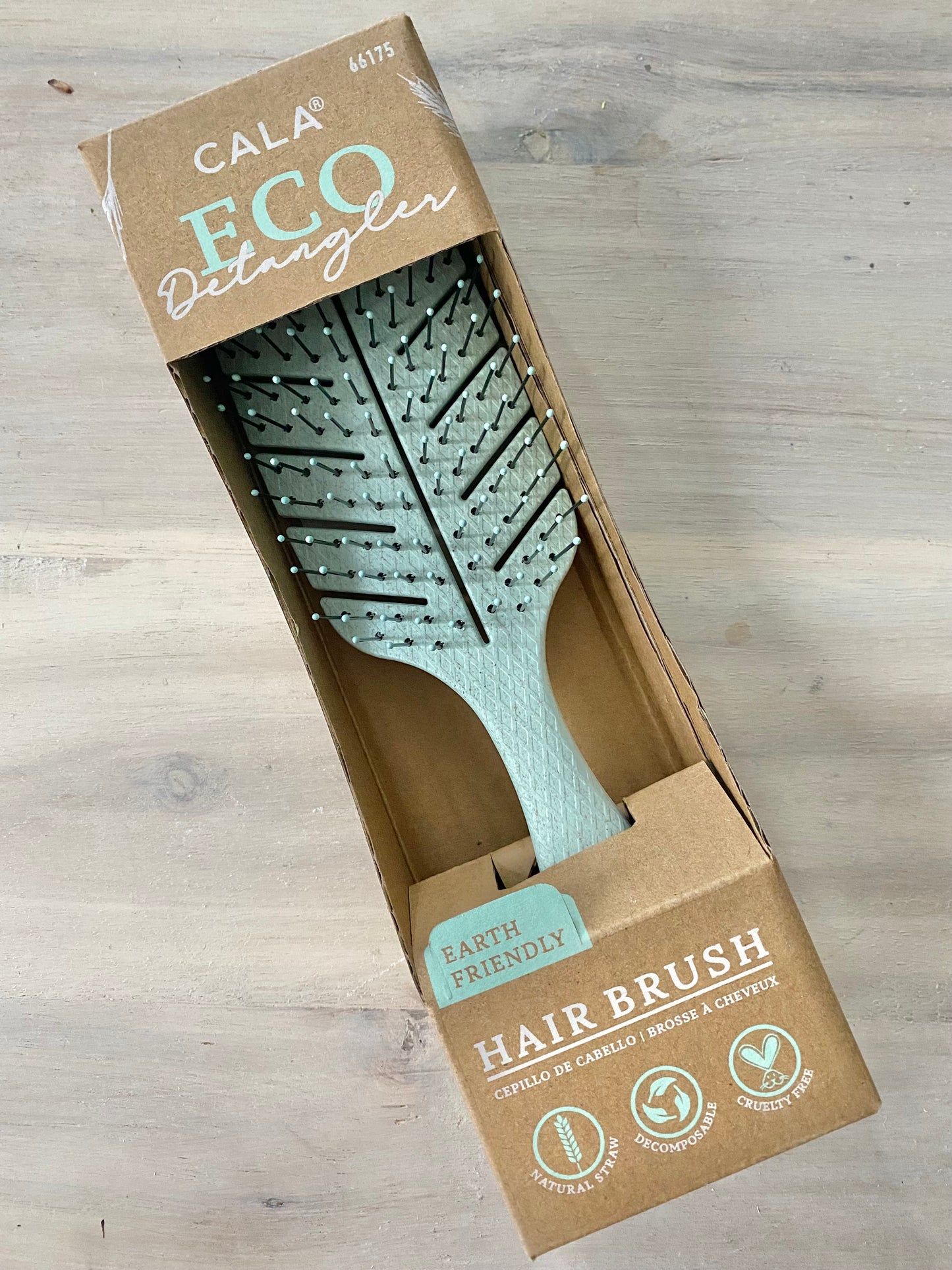 Detangling brush in box labeled decompostable, cruelty free, and earth friendly.